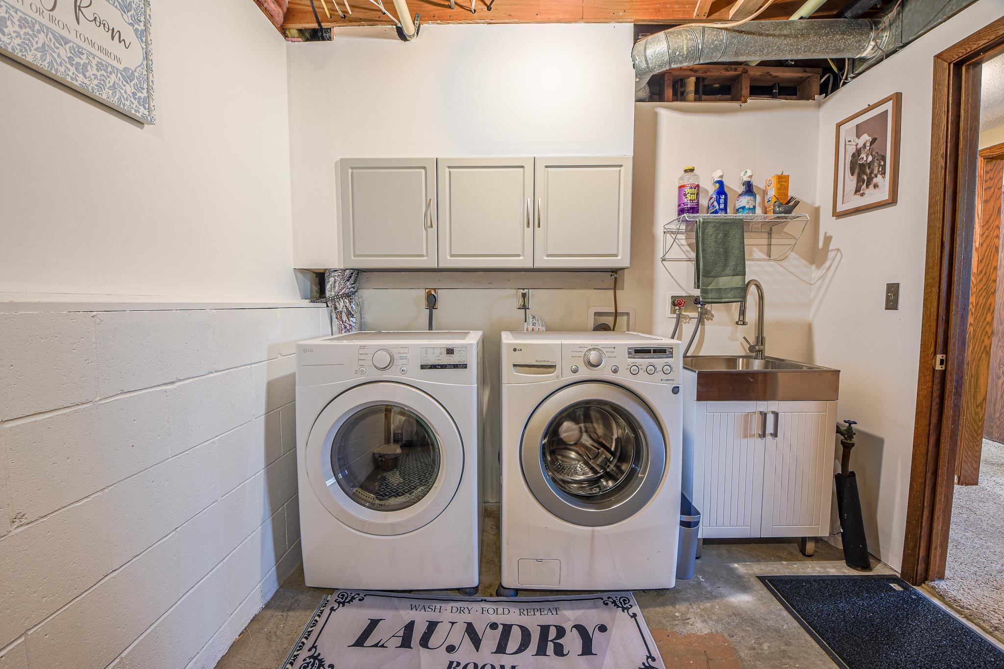Lower level laundry room with convenient utility sink.