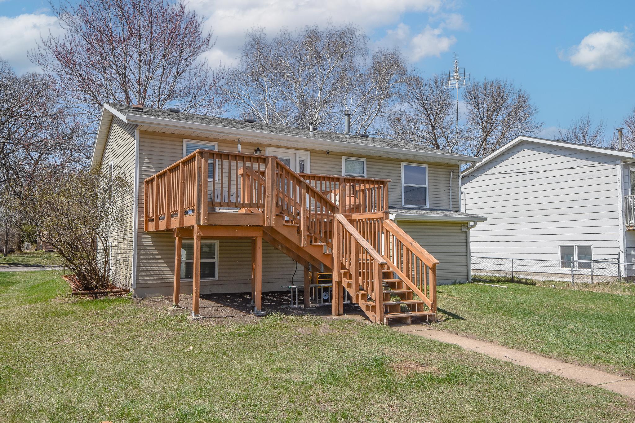 Deck walks down to the backyard and lends access to detached garage.