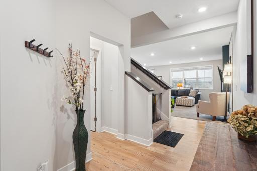 View of stairway to the upstairs and large great room/living room area