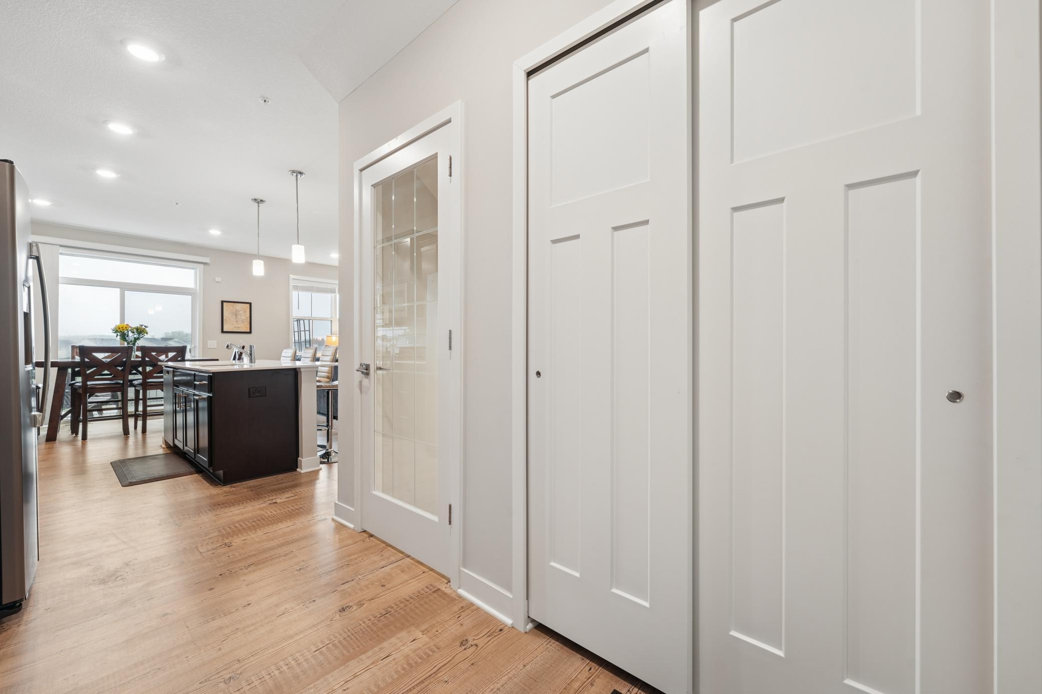 This is the back hallway and mudroom area. The gorgeous glass door takes you to the finished lower level walkout.