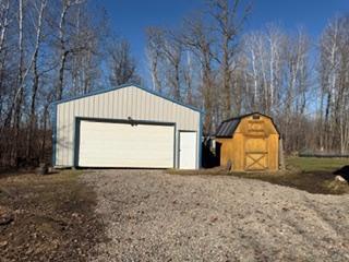 Pole building/garage and newer storage shed.