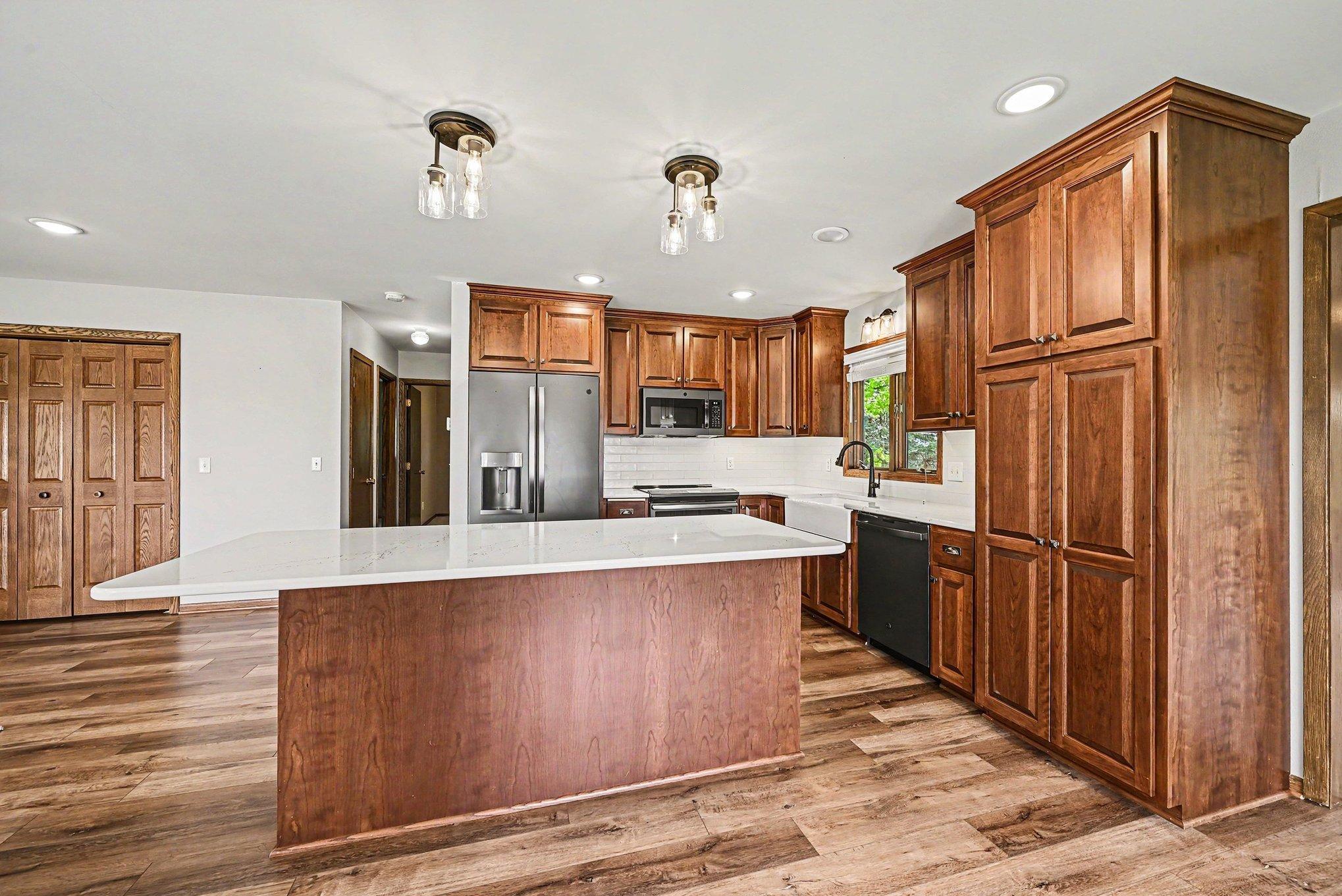 Updated kitchen with Cambria counters, island, and custom cabinetry