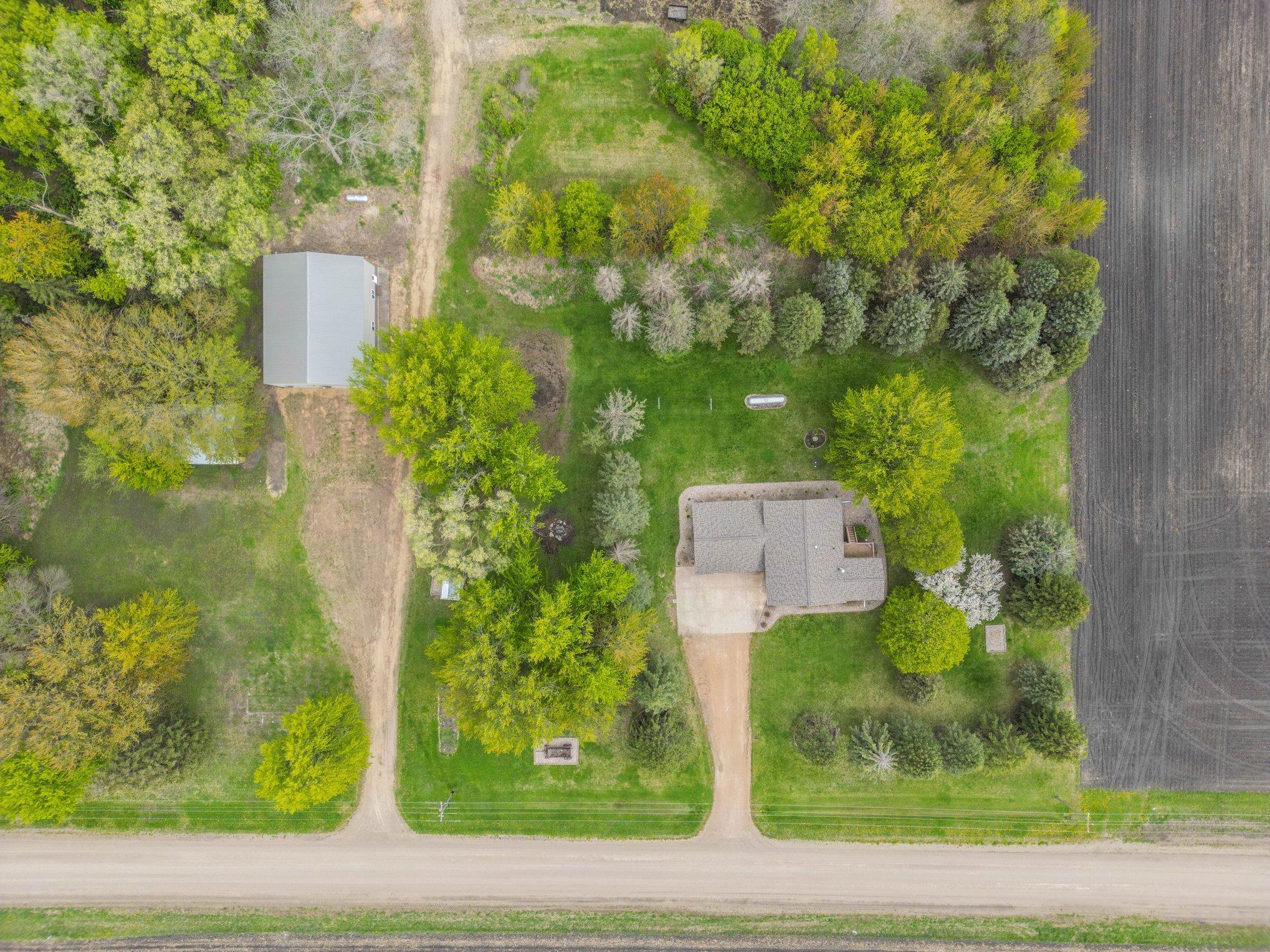 Overhead aerial of the home, shed, and acreage