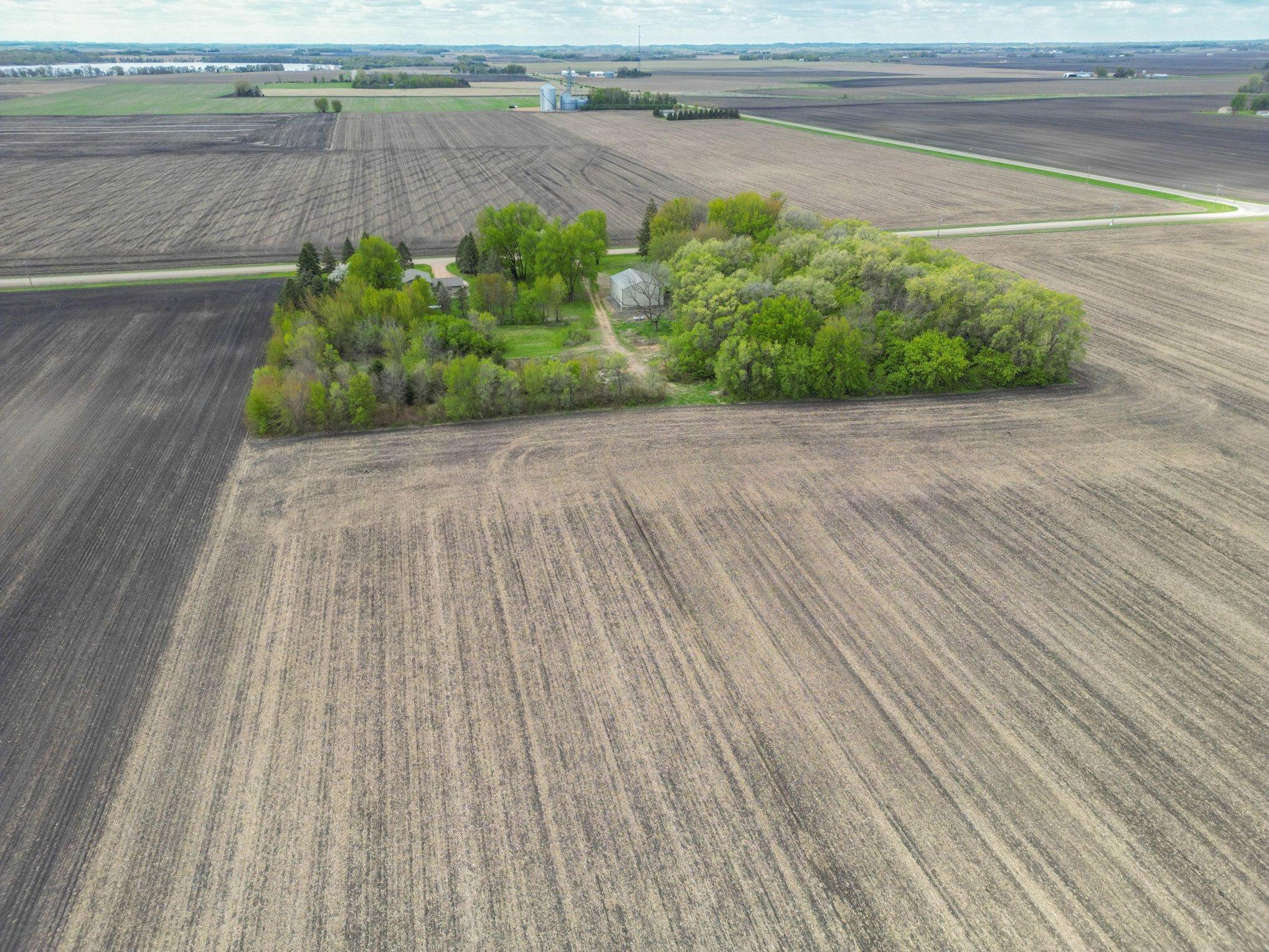 Rear-angle aerial showing the home site and outbuilding