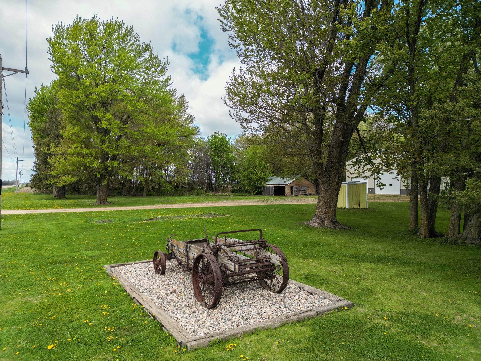 Front yard with mature trees and country views