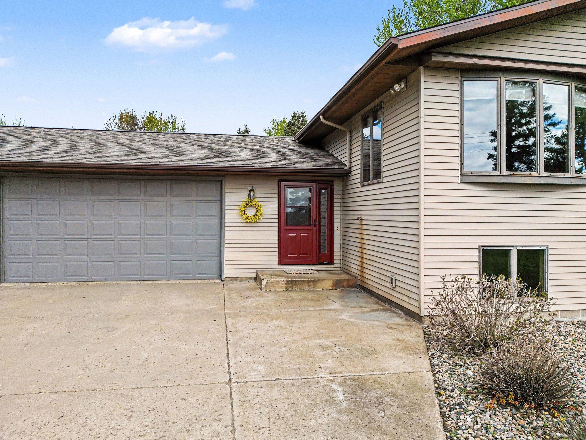 Front entry and insulated heated 2-car garage that has extra deep space