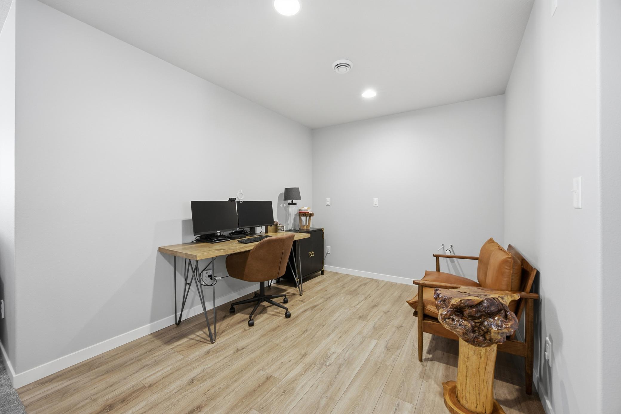 Office Area with Laminate Flooring and Wet Bar Roughed-In