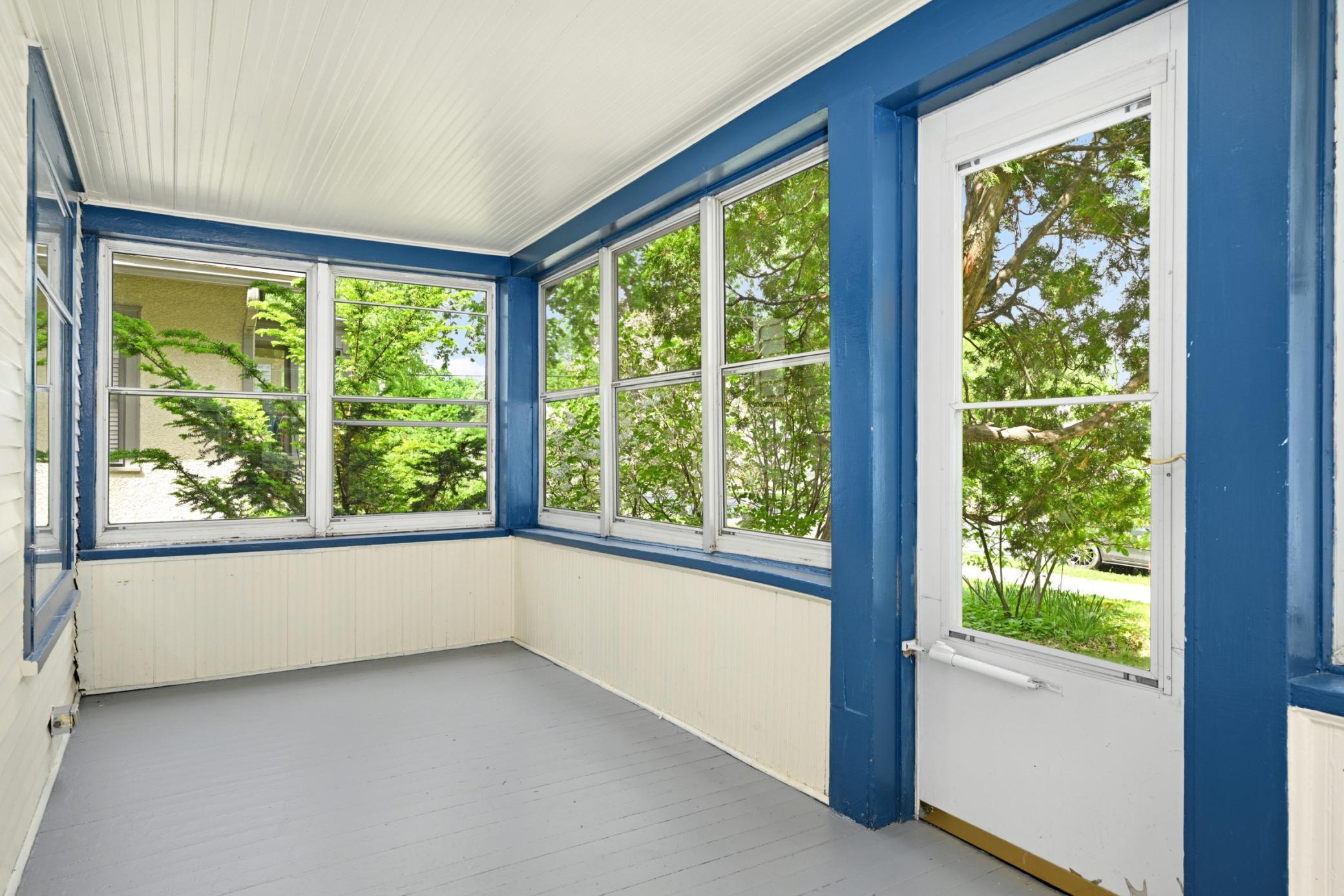 Inviting front porch perfect for morning coffee.
