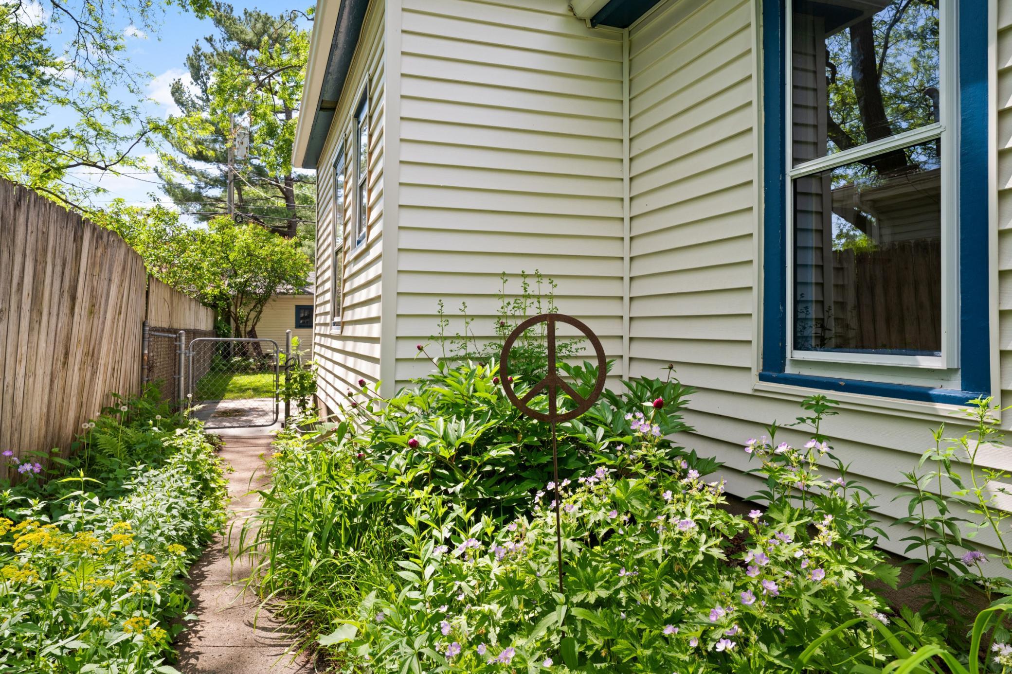 Side yard thoughtfully planted as a pollinator garden.