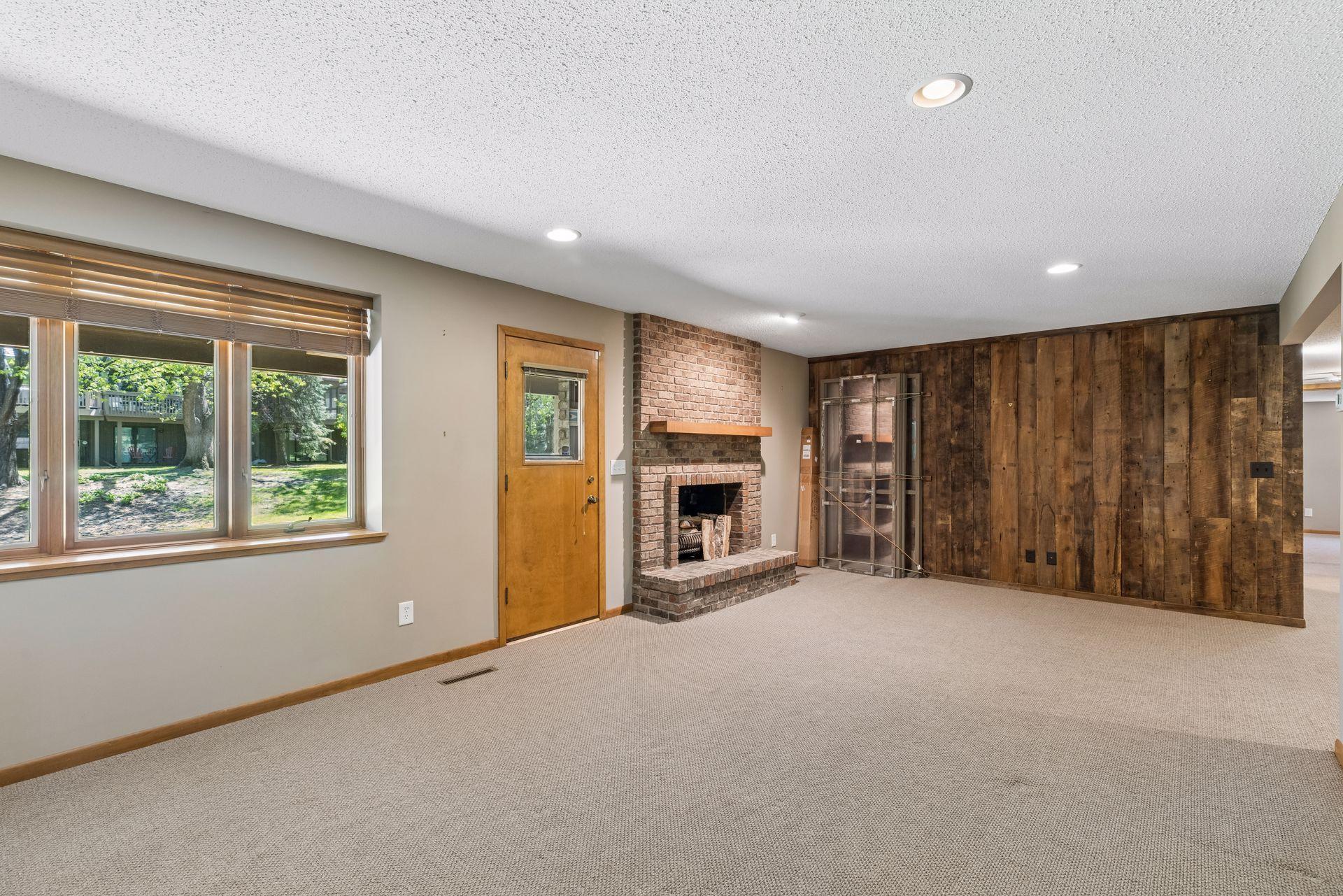 Lower Level Family room with Wood Burning Fireplace