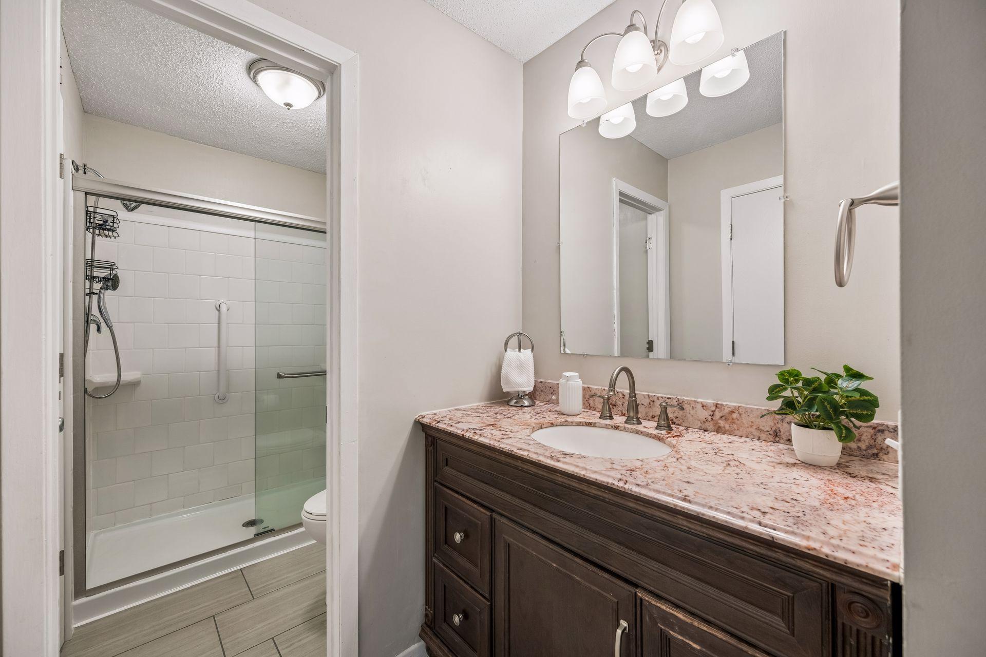 Private 3/4 primary bathroom with additional linen closet