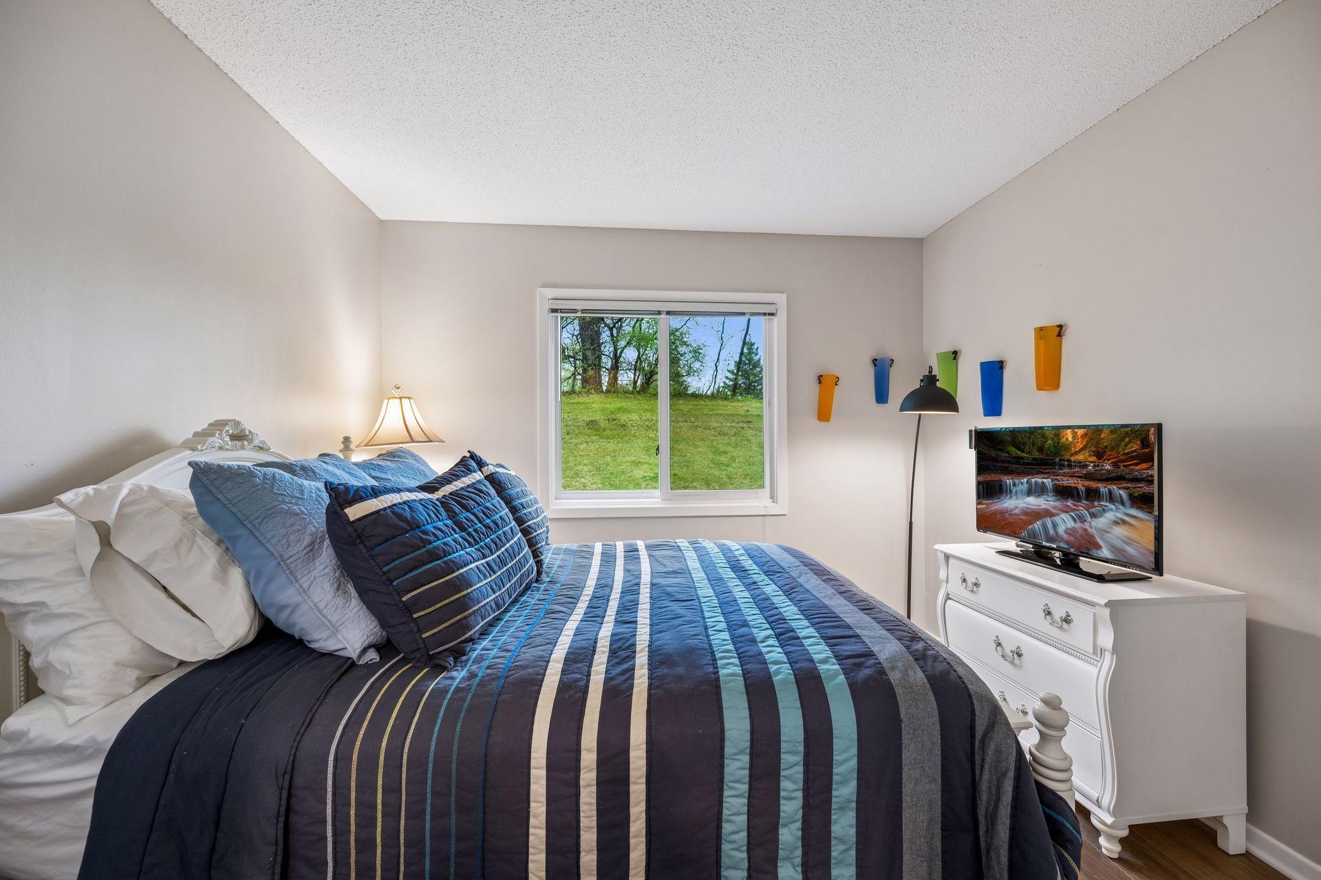 Second bedroom looking out to the private grounds