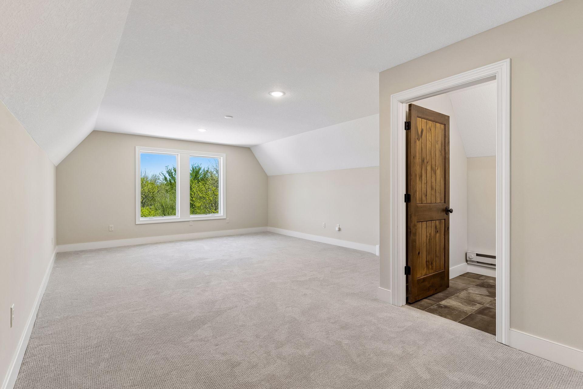 Flexible upper-level bonus room above the garage, ideal for fitness, crafts, hobbies, or a private retreat.