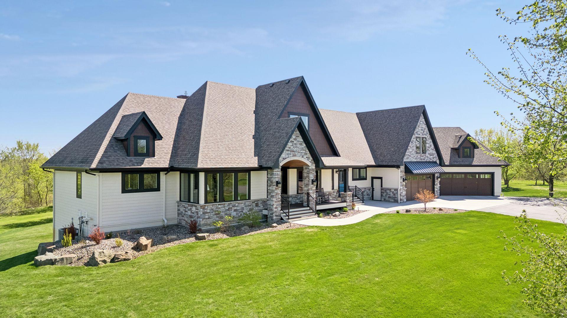 Perched atop the rolling Minnesota countryside, this private 23-acre estate offers a rare blend of luxury, seclusion, and timeless architectural character.