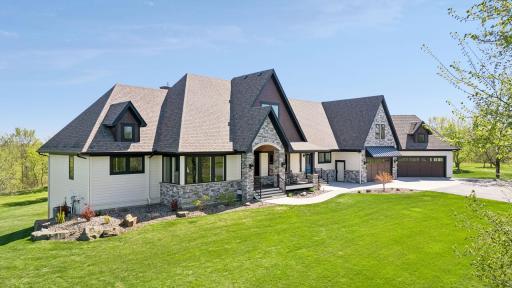 Perched atop the rolling Minnesota countryside, this private 23-acre estate offers a rare blend of luxury, seclusion, and timeless architectural character.
