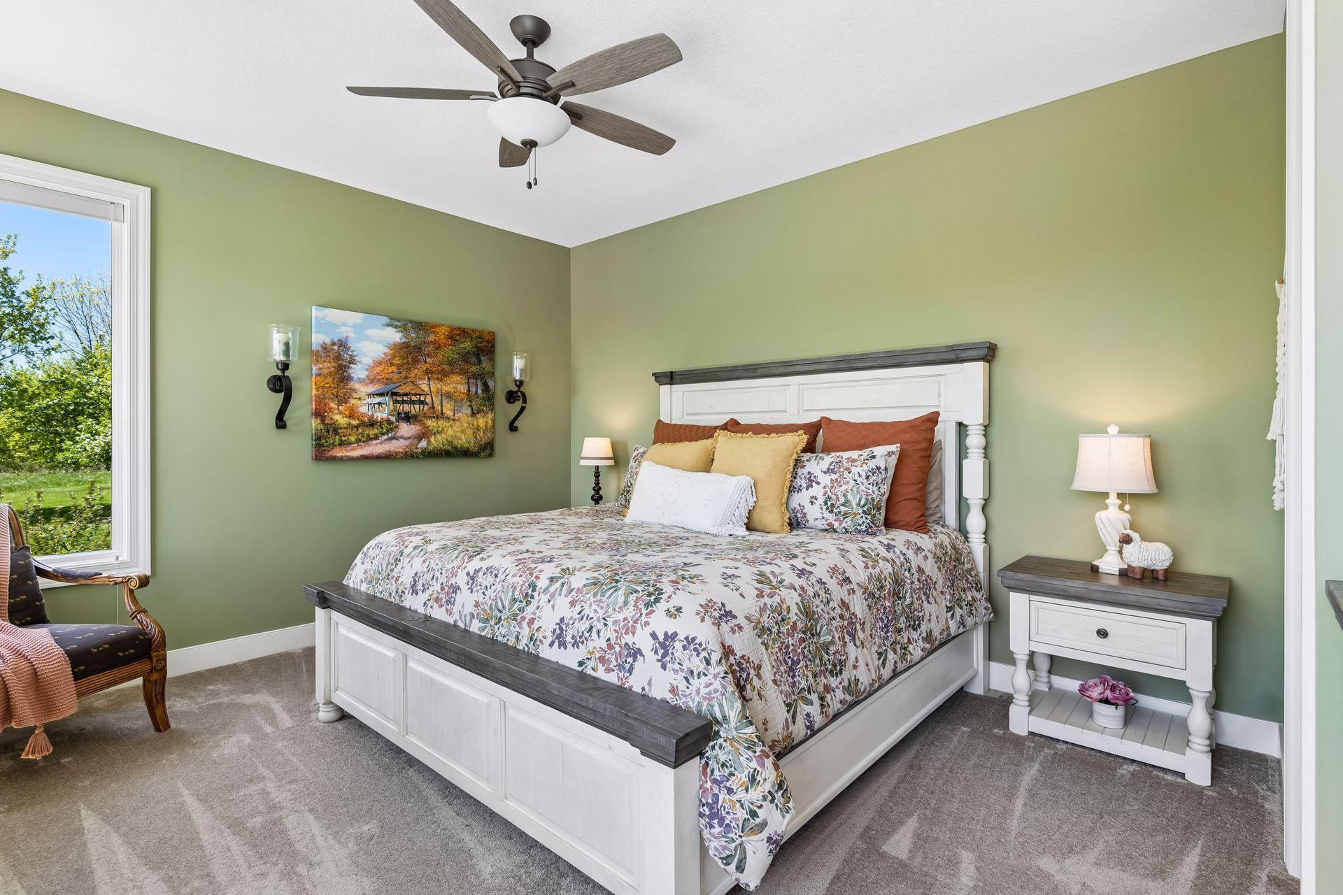 A comfortable main-floor ensuite bedroom offers privacy for guests or family, with generous natural light, soft finishes, and convenient access to its own private bath.