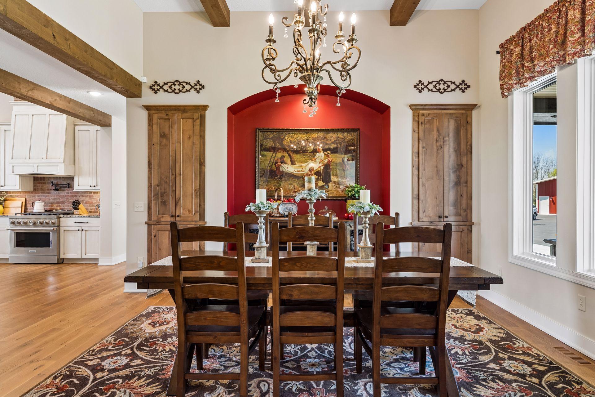 An elegant formal dining space designed for gathering, featuring custom wall insets, large enough to accommodate an oversized dining table for hosting family and guests.