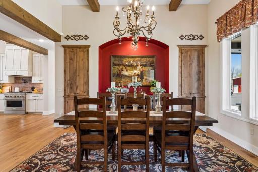 An elegant formal dining space designed for gathering, featuring custom wall insets, large enough to accommodate an oversized dining table for hosting family and guests.