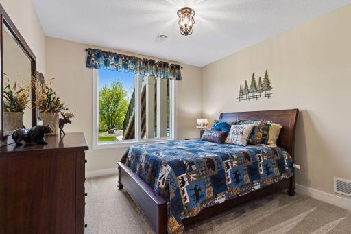 A second lower-level bedroom adds excellent flexibility for guests, family, or extended-stay accommodations.