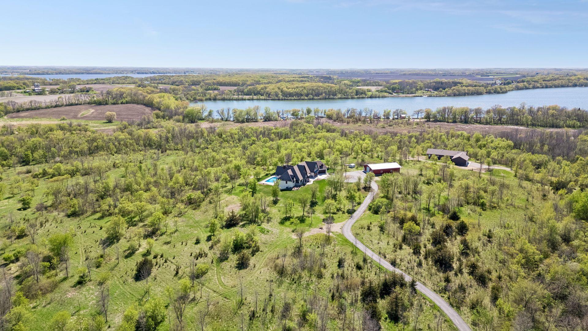 A rare 23-acre private estate in Faribault, offering sweeping views, mature trees, open green space, multiple outbuildings, and a peaceful setting near Mazaska Lake