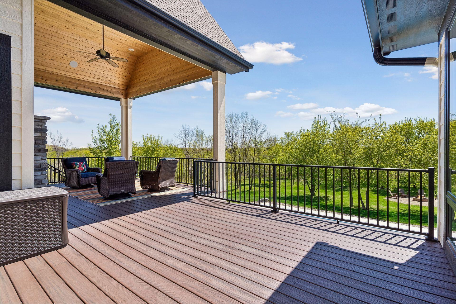 Expansive composite deck with sweeping backyard views and room to entertain or relax.