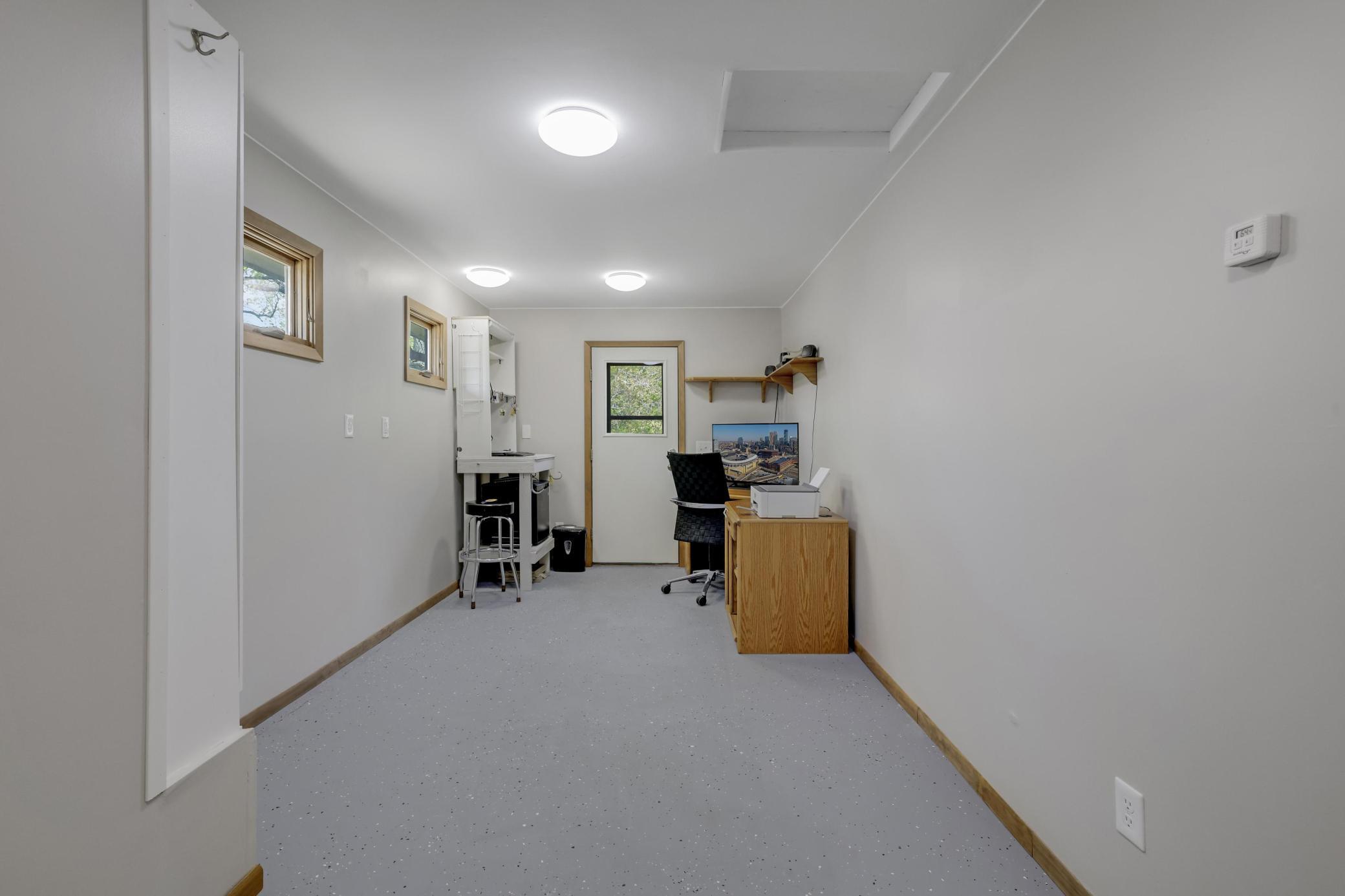 Flex Room on main level next to the great room with door that accesses backyard as well as door to garage. Perfect for home office, shop, exercise room, playroom, craft room, etc.