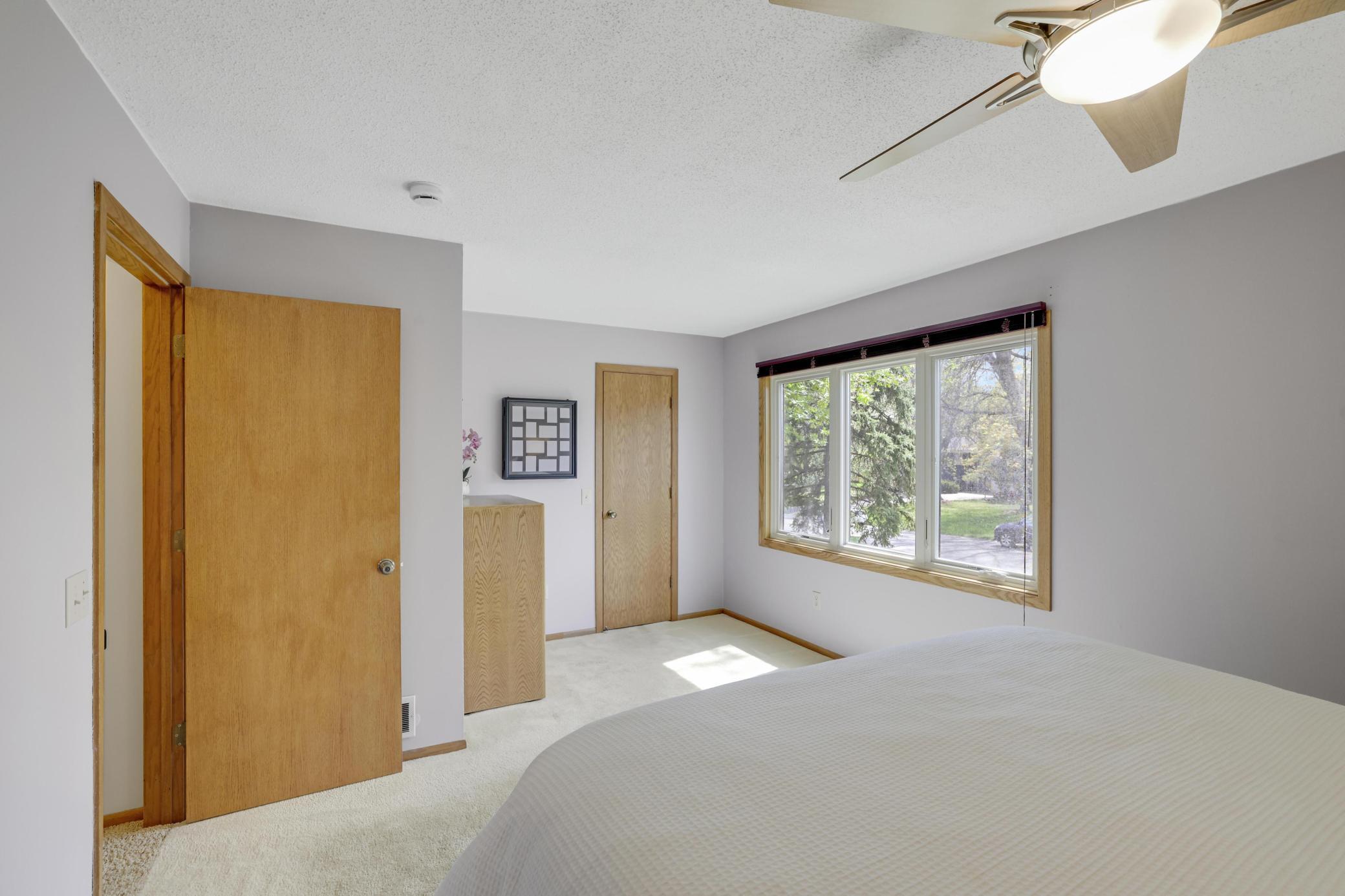 Primary bedroom with walk-in closet.