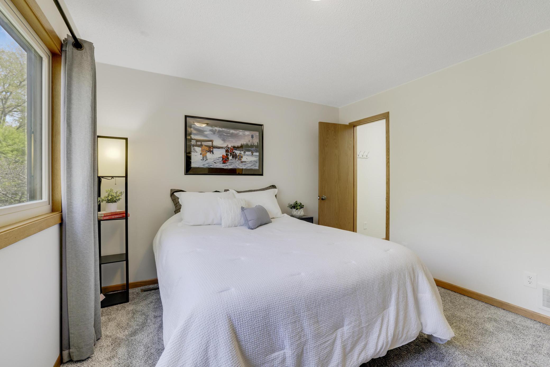 Second upper level bedroom with walk-in closet.