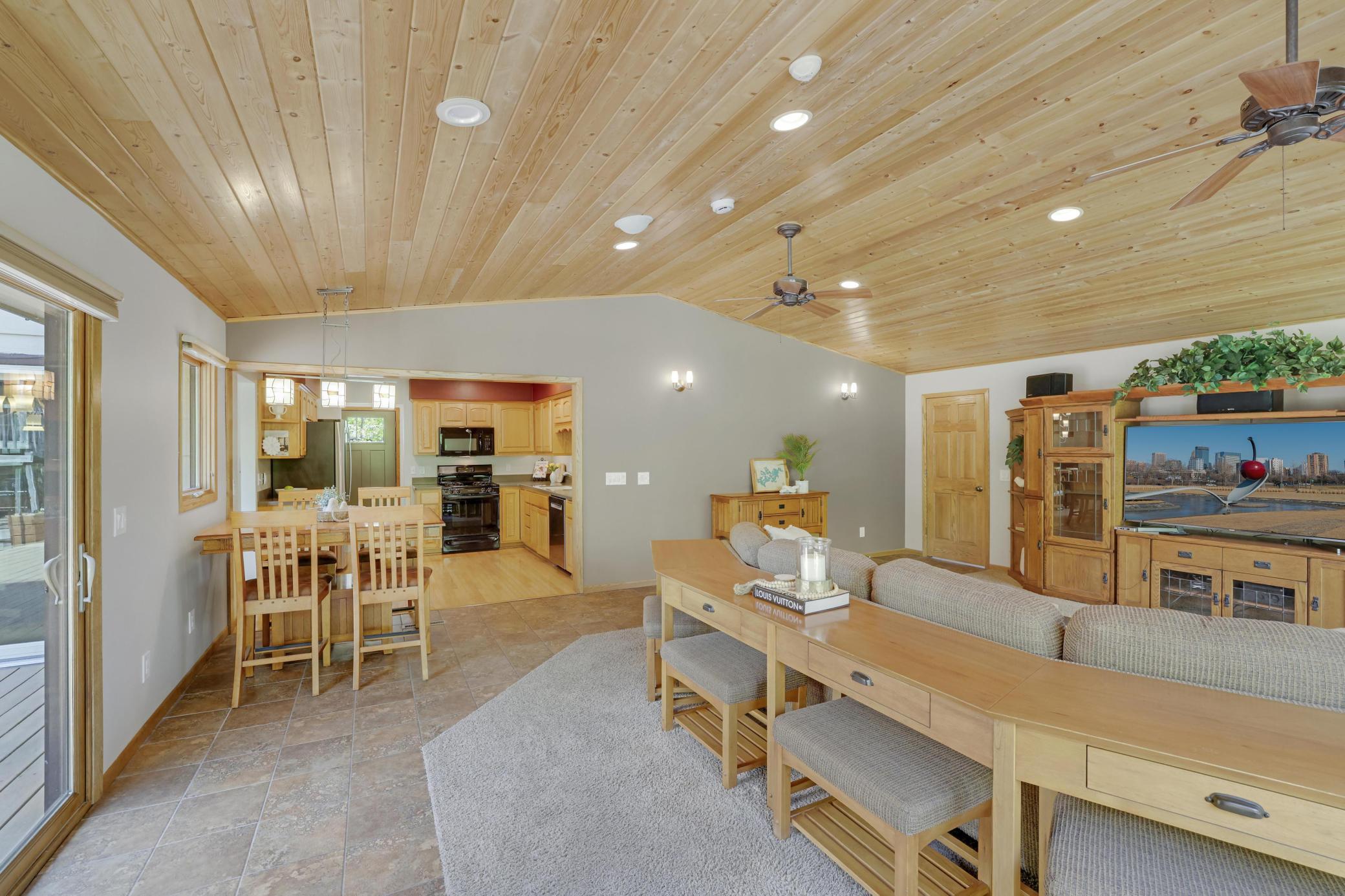 Great room right off the kitchen with space for kitchen table.
