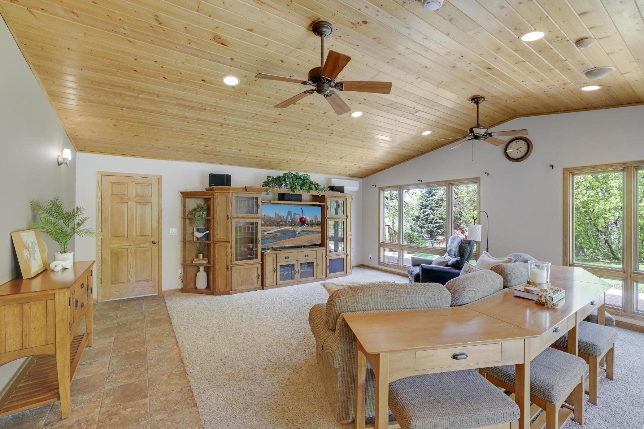 Beautiful vaulted wood ceiling with ceiling fans.