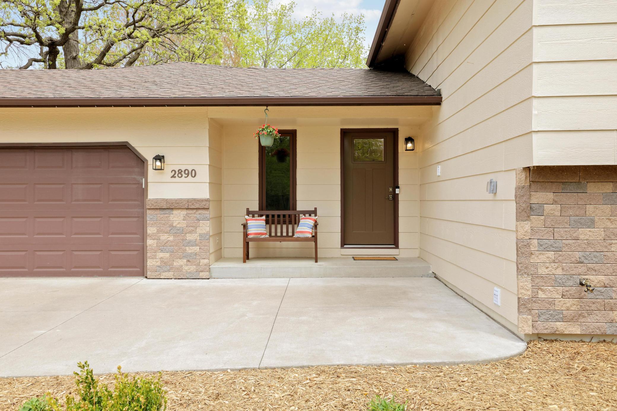 Front porch with concrete patio for extra seating.