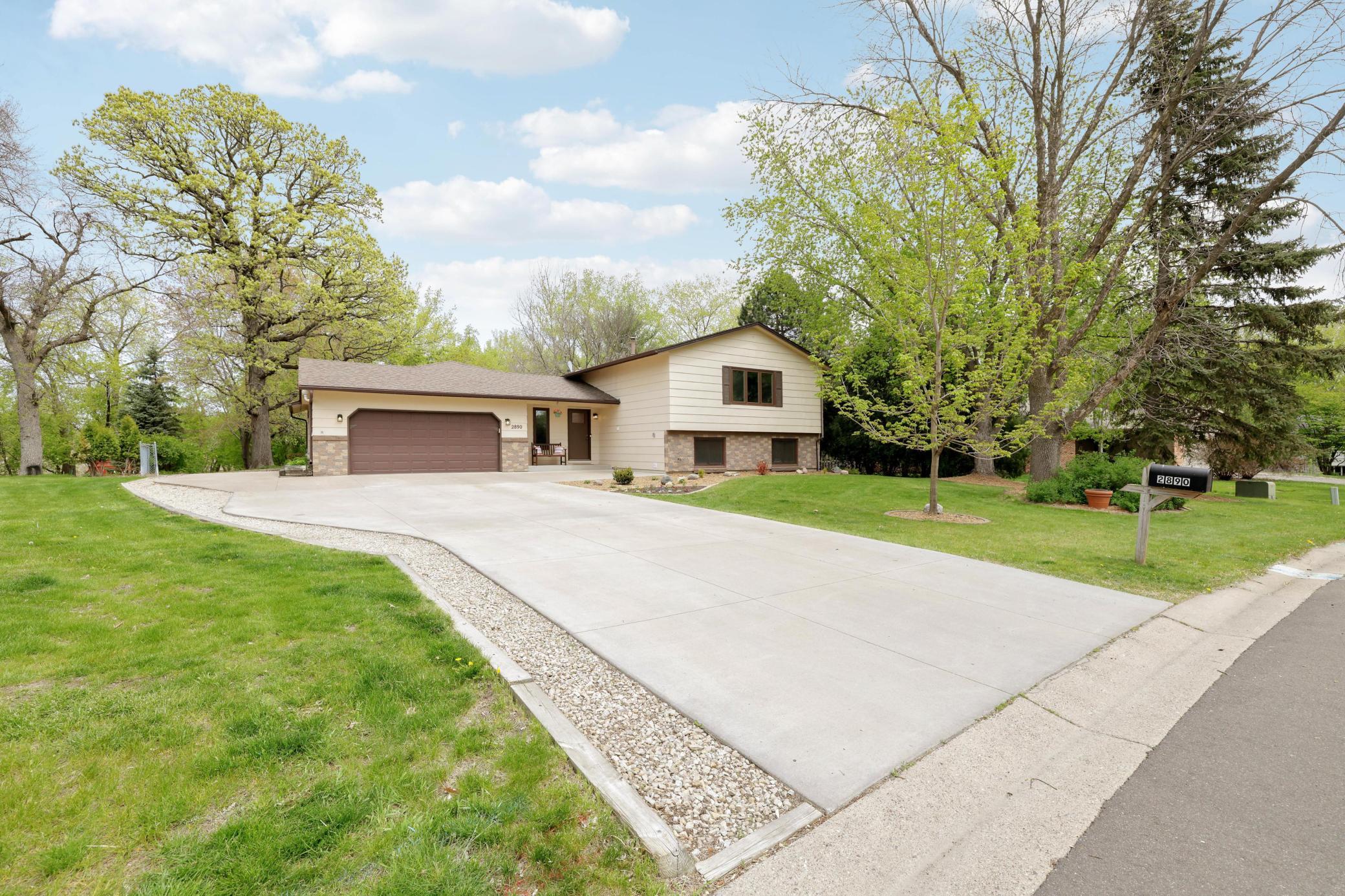 Large concrete driveway with extra parking space or guests or recreational vehicles