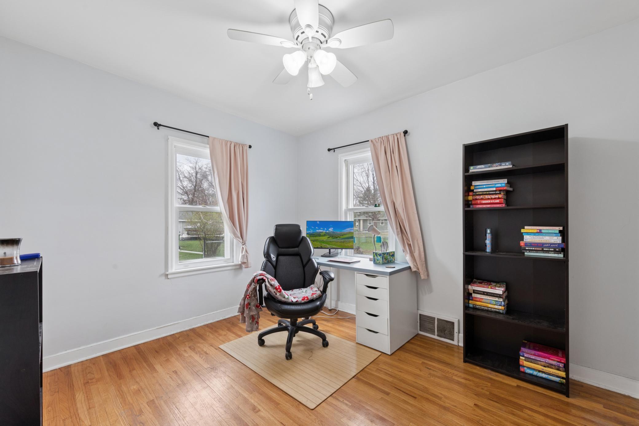 Bright main-level room with hardwood floors—ideal as a bedroom, office, or study.