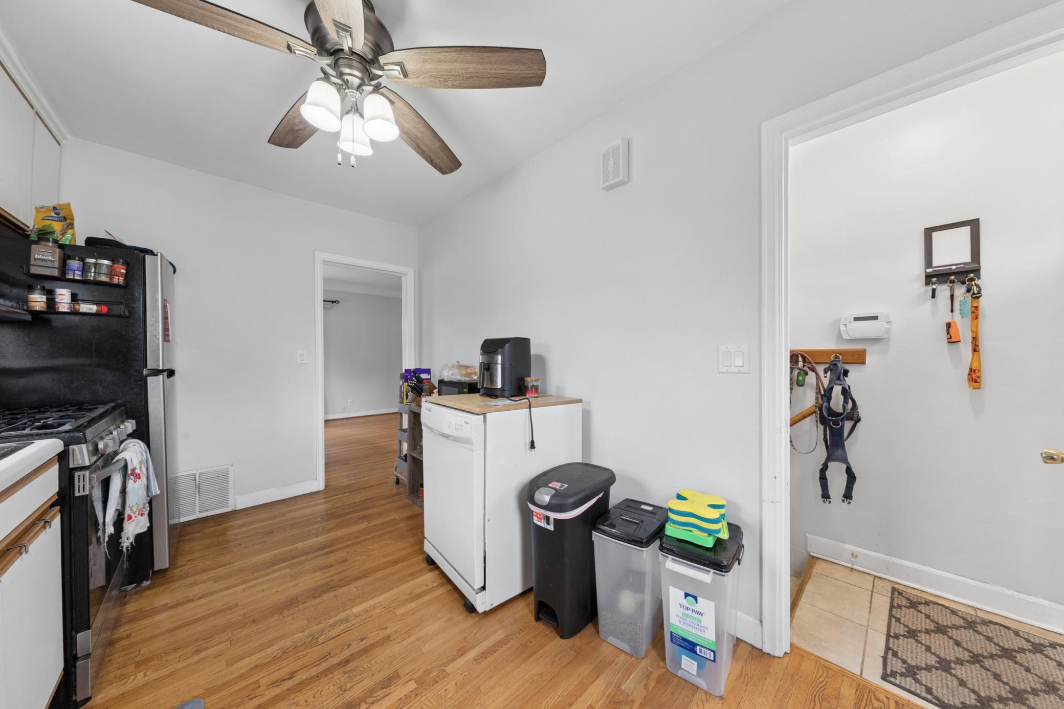 Kitchen with convenient layout, additional storage, and access to side entry/mudroom area.