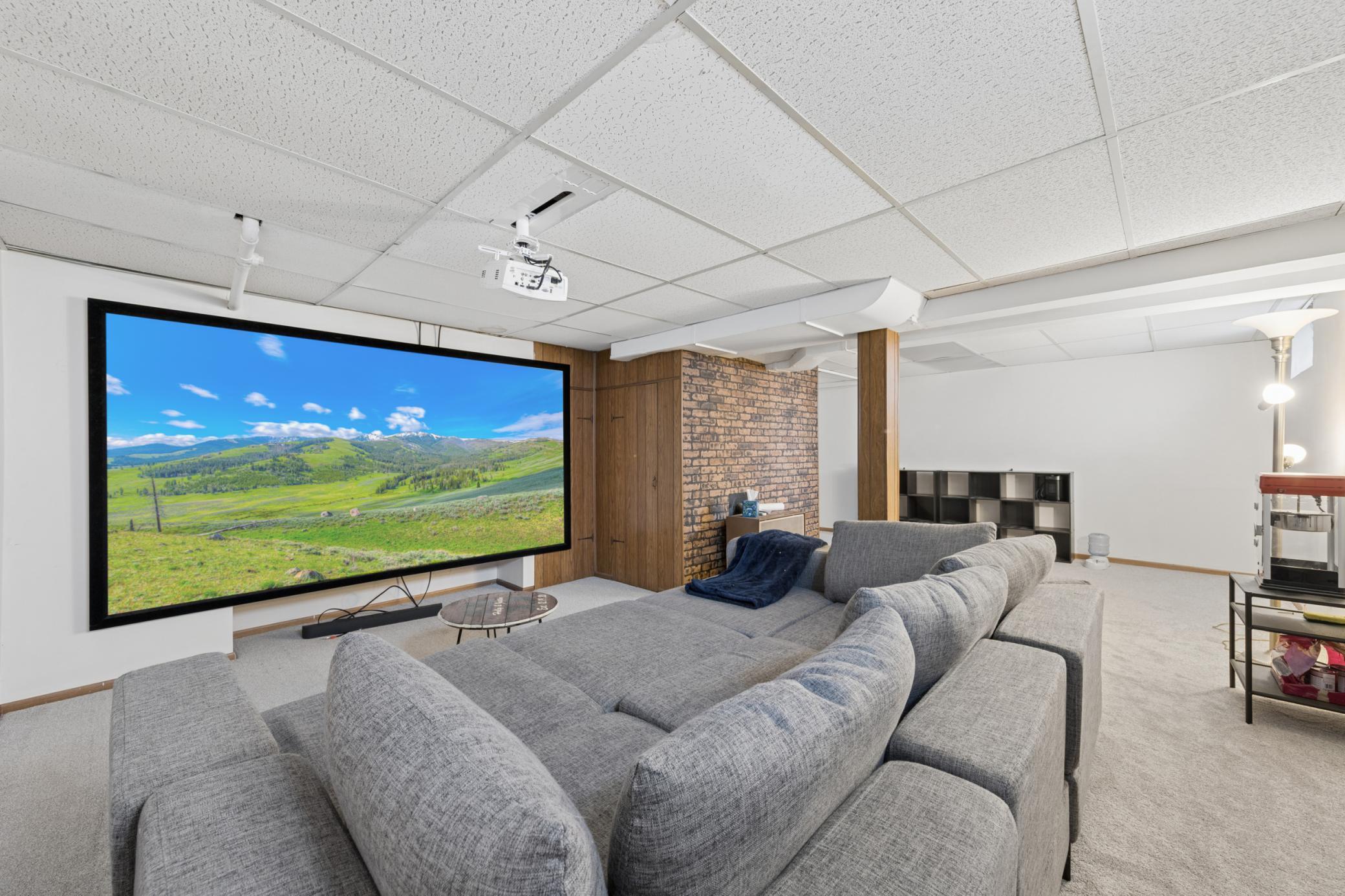 Expansive lower-level living area with space for a media setup or recreation zone.