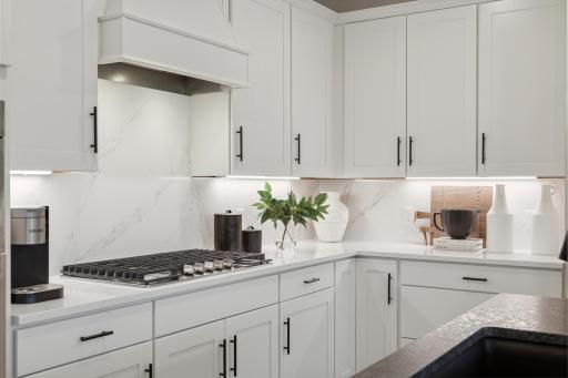 Kitchen with quartz countertops and stainless steel appliances