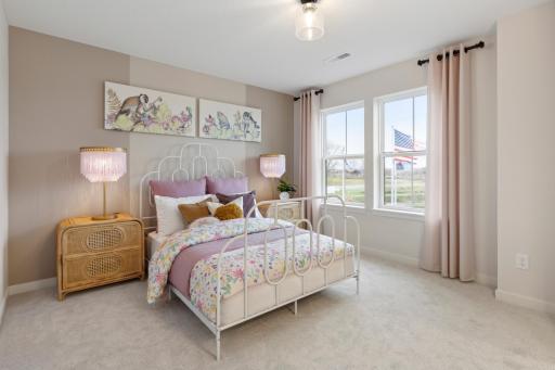 Secondary bedrooms are nicely sized with walk-in closets