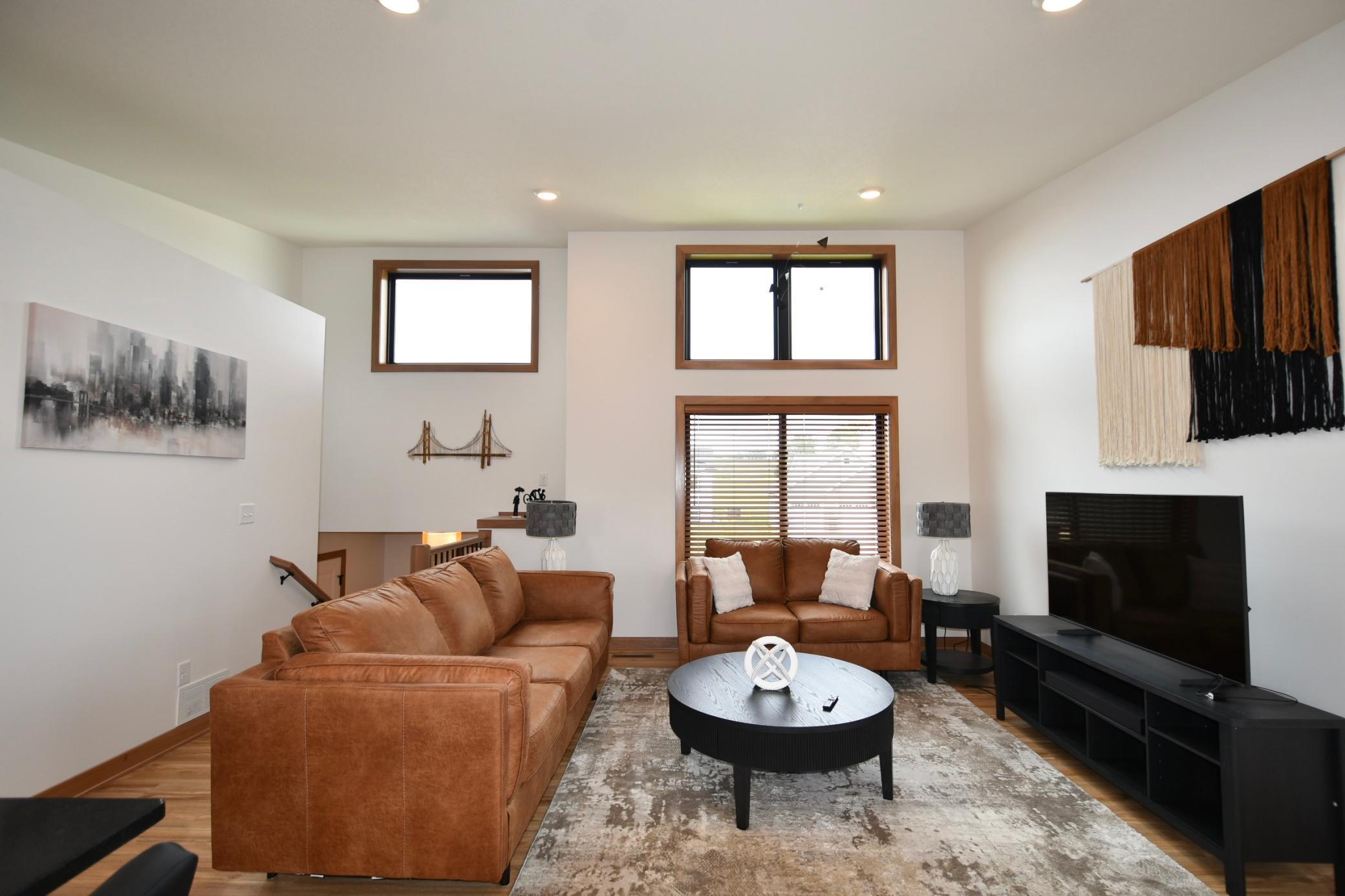 Main floor living room with an abundance of natural light