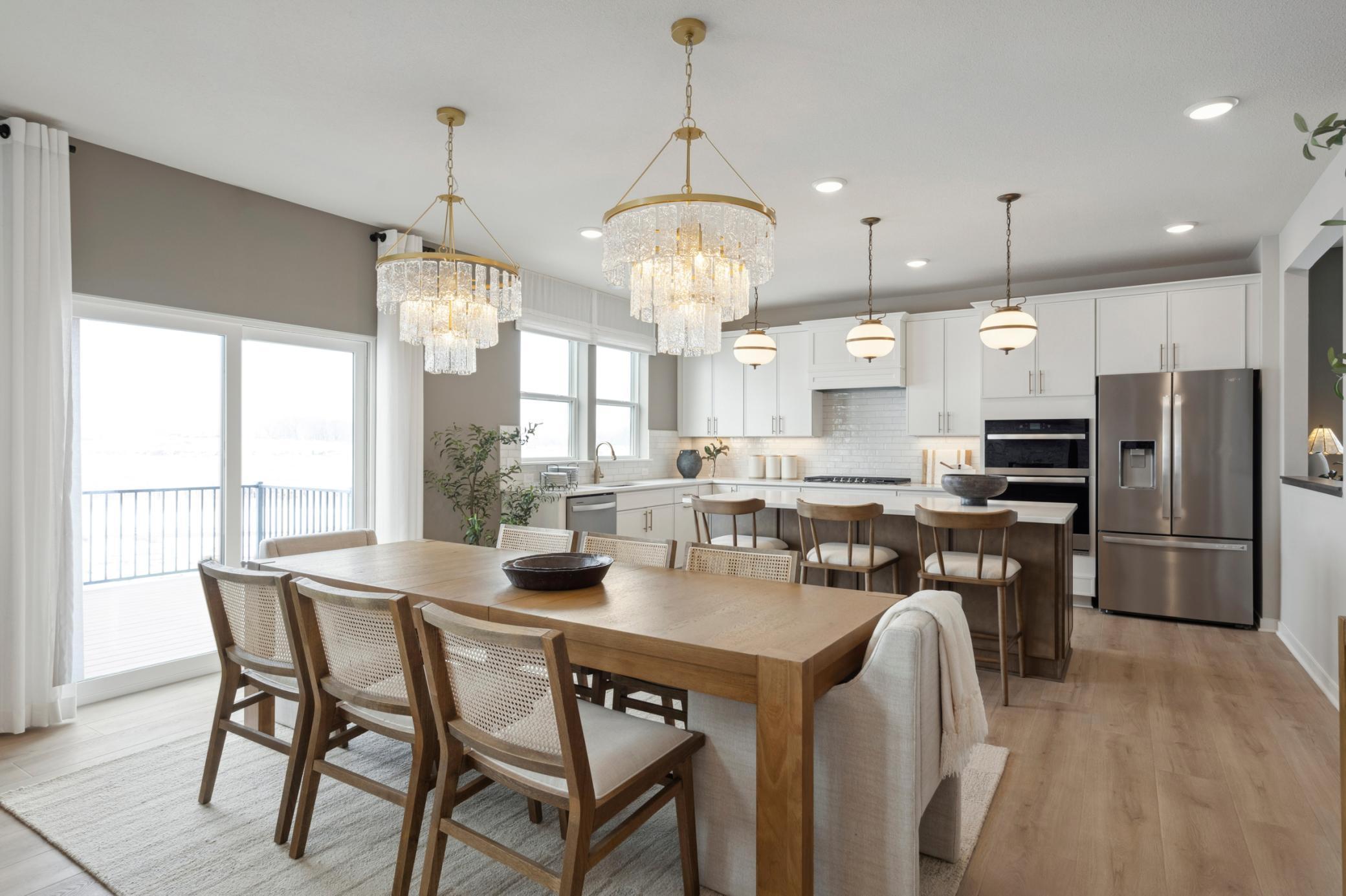 Perfectly appointed dinette area seamlessly blends into the open floorplan, ideal for casual meals, a morning coffee spot, or additional seating when entertaining.