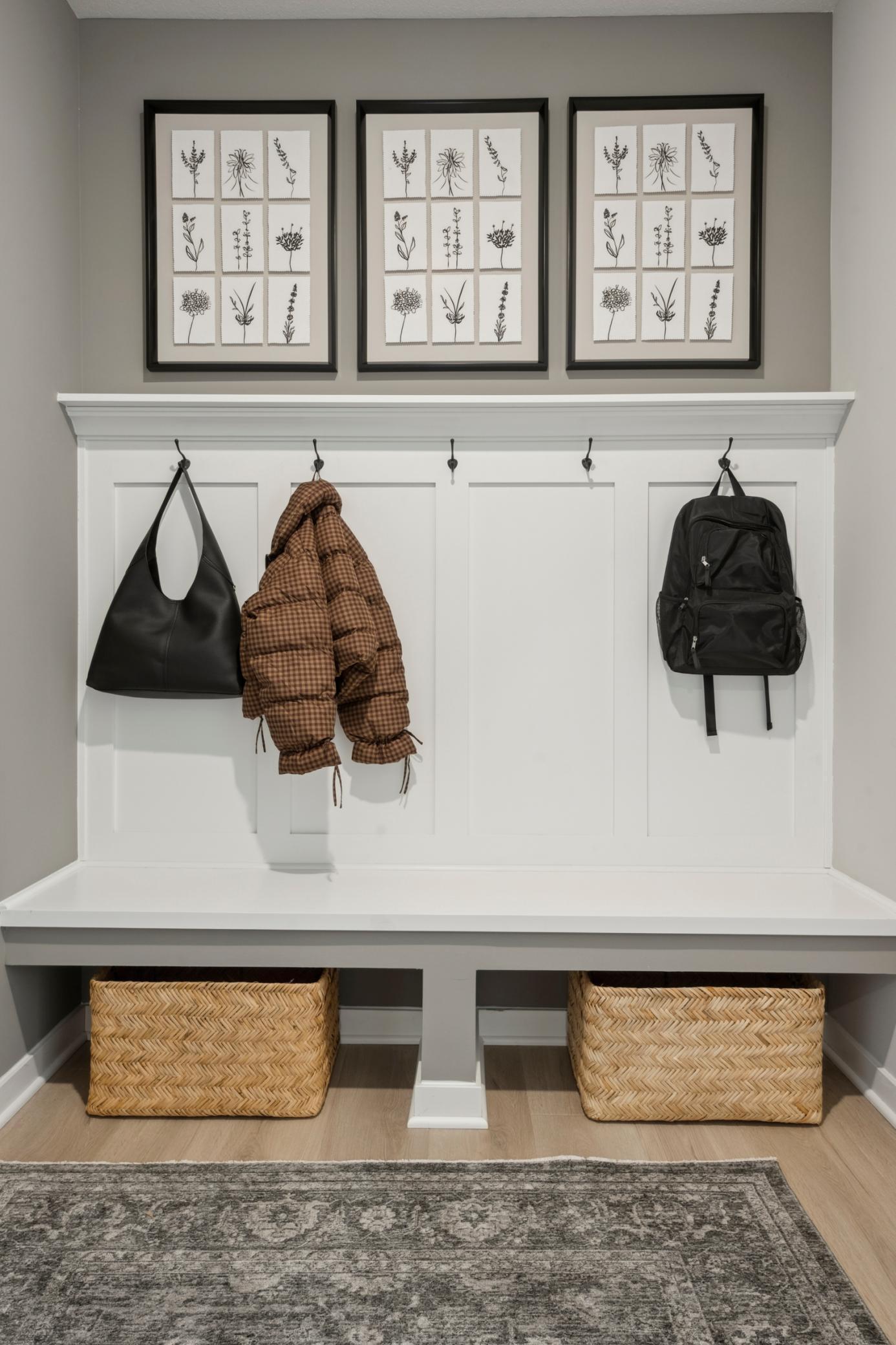 Durable flooring and walk-in closet with a beautiful mudroom bench. create a clean, functional workspace that feels just as thoughtfully designed as the rest of the home.