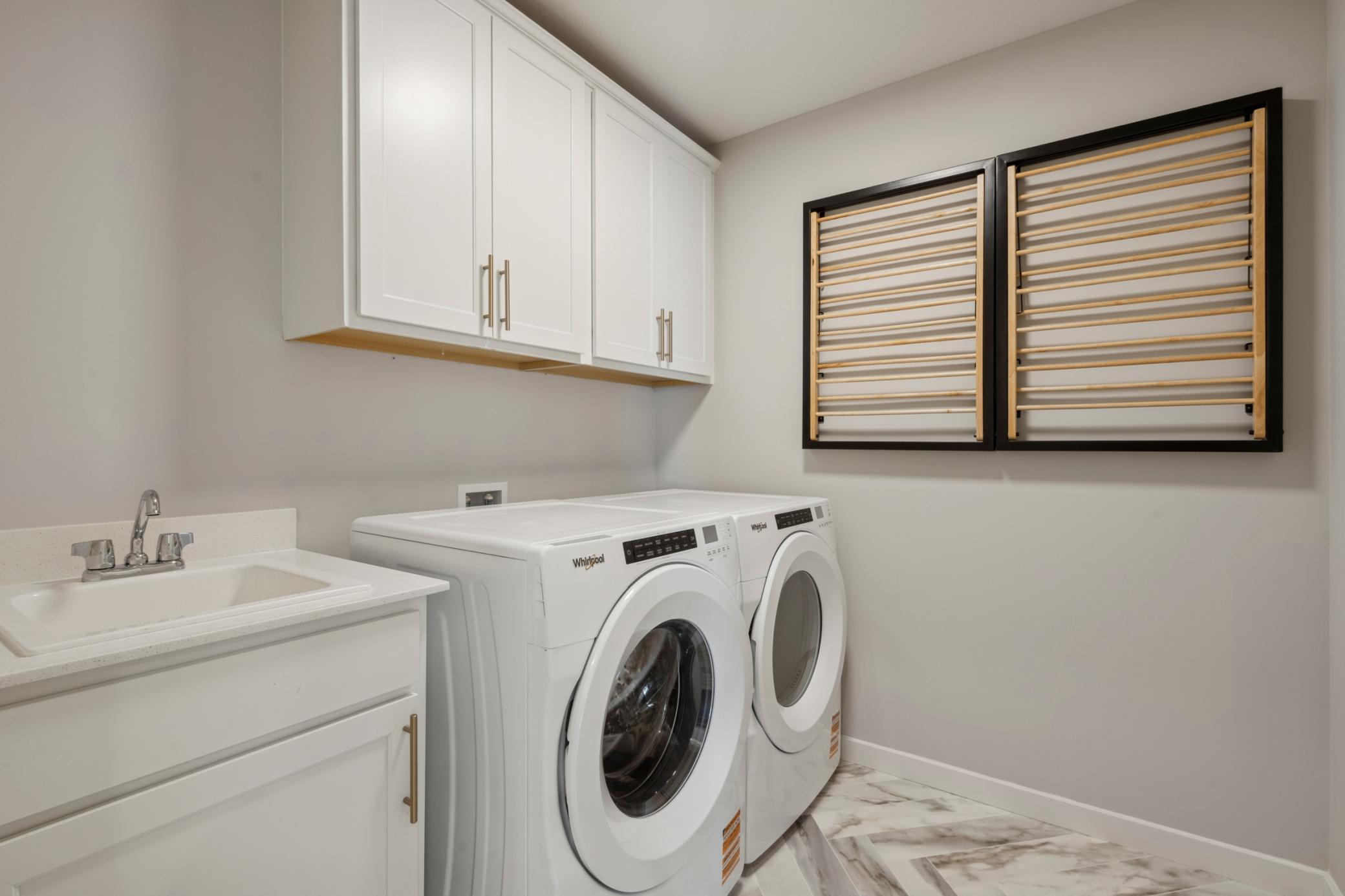 Conveniently located on the same level as the bedrooms, the laundry area offers efficient access and eliminates the need for carrying loads up and down the stairs.