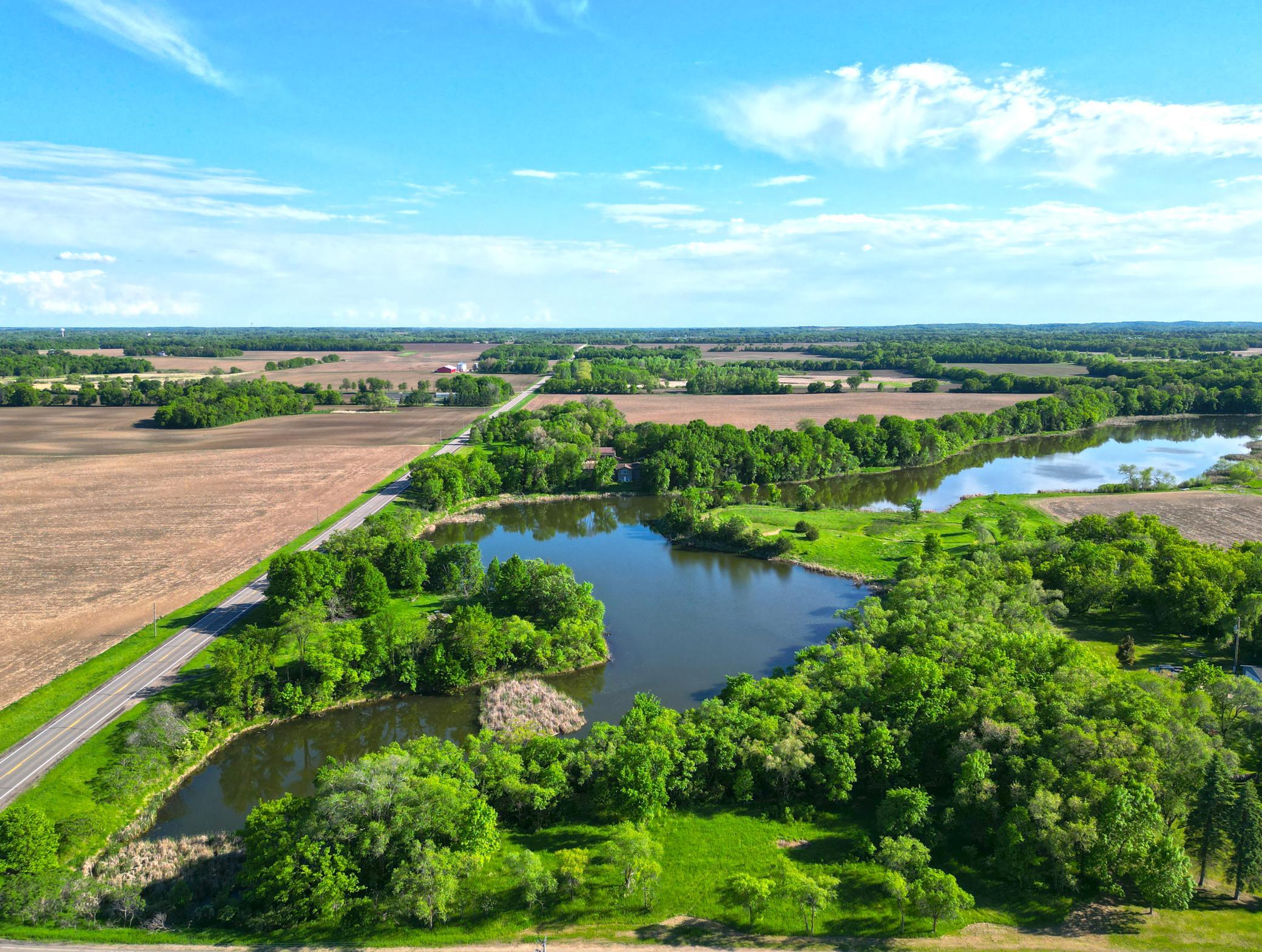 Tucked into a beautiful natural setting, this 8.93-acre parcel overlooks a tranquil environmental lake.