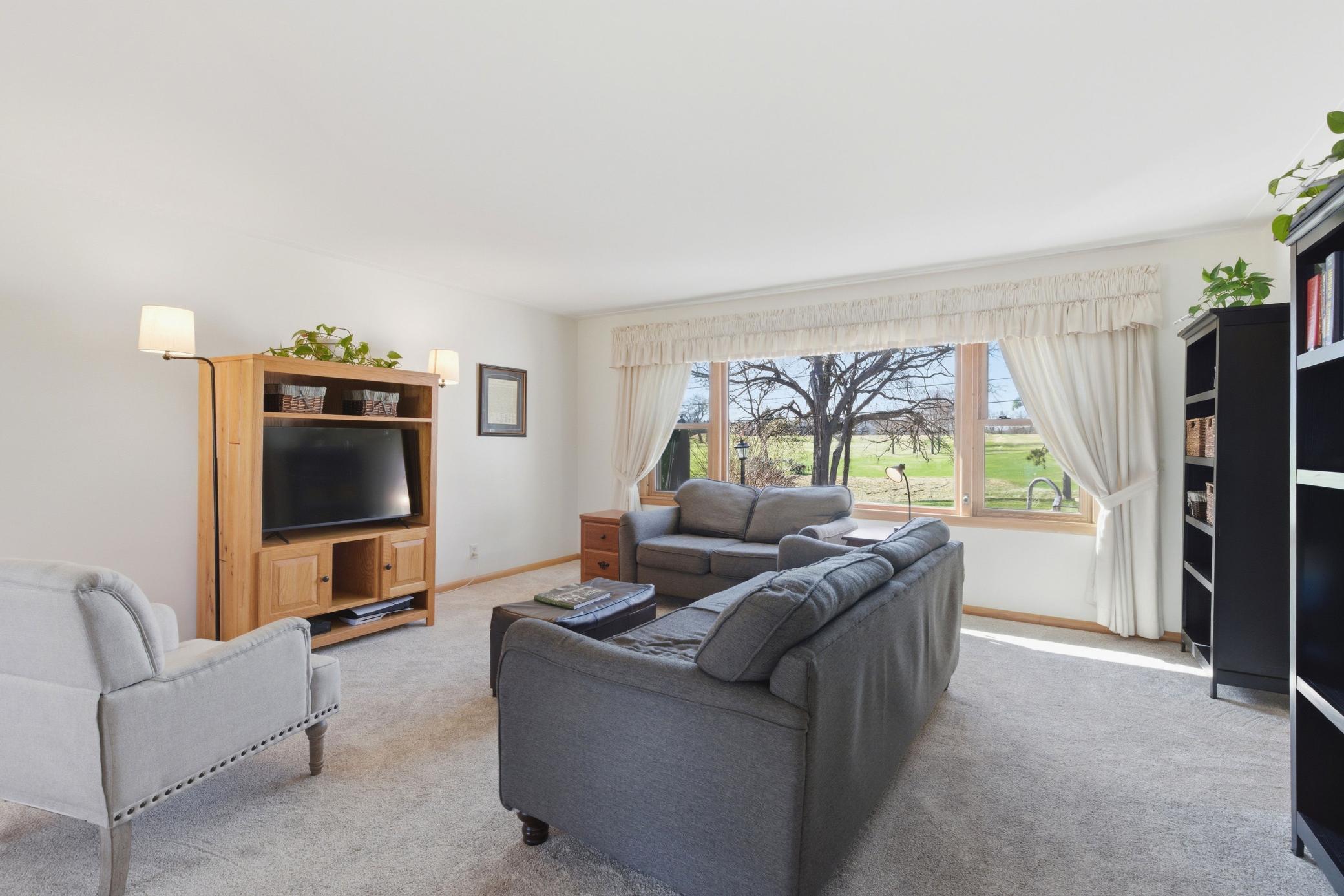 Living room with views of golf course