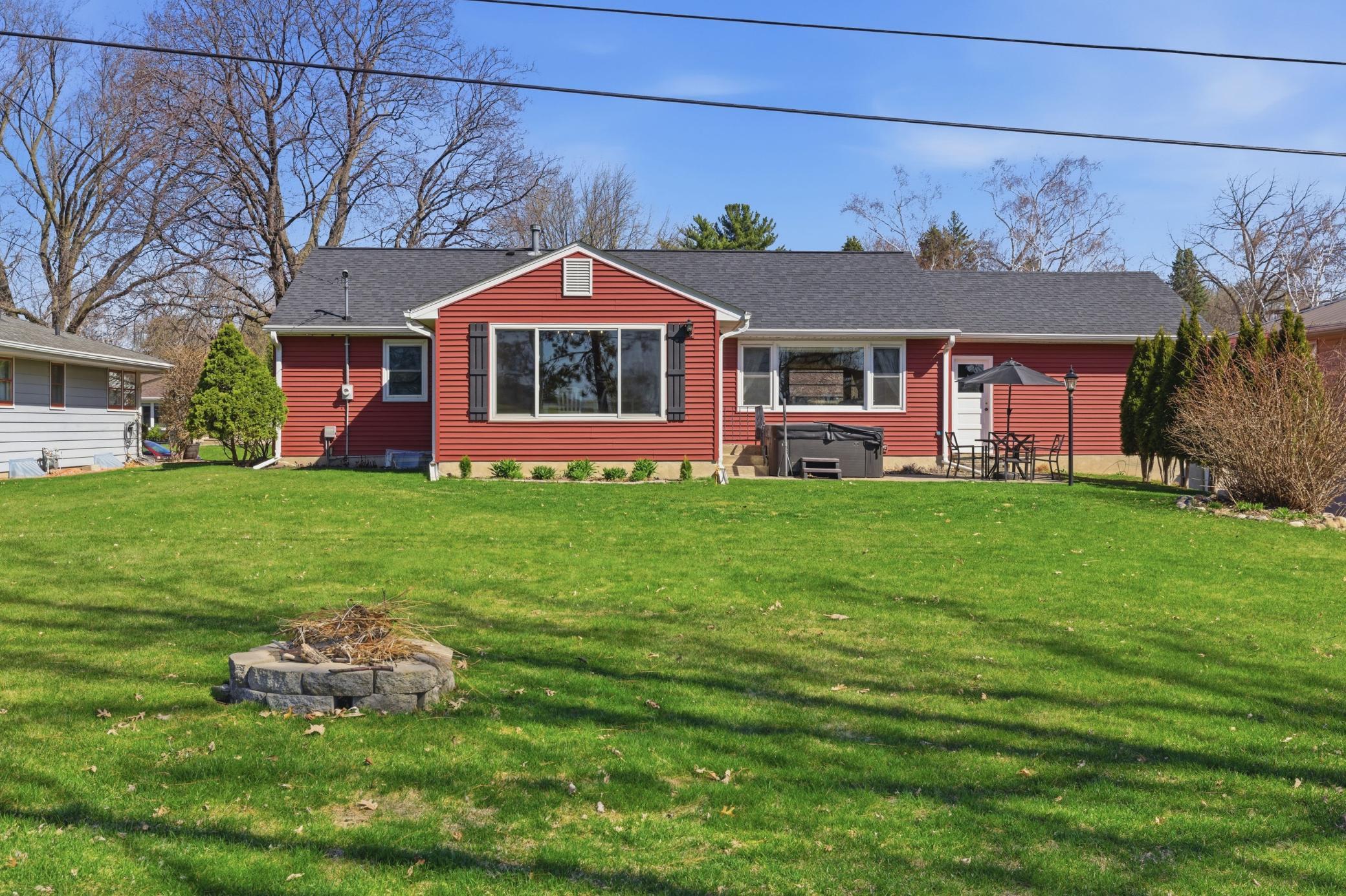 Rear view of home with family room addition