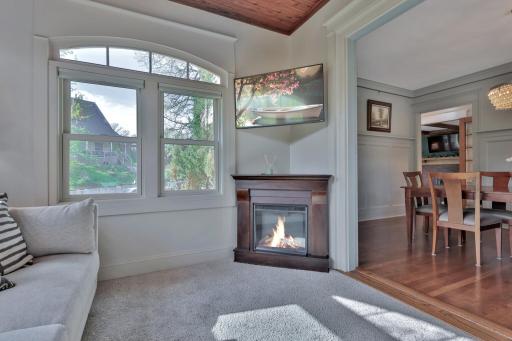 Sun-soaked retreat with a beautiful wood-plank ceiling and elegant arched windows. A bright, versatile space designed for ultimate relaxation.