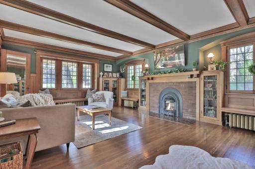 Spacious and sophisticated! Enjoy the warmth of the gas fireplace framed by custom built-ins and exquisite wood detailing. Dramatic beam ceilings and large windows create a bright, lodge-like feel.