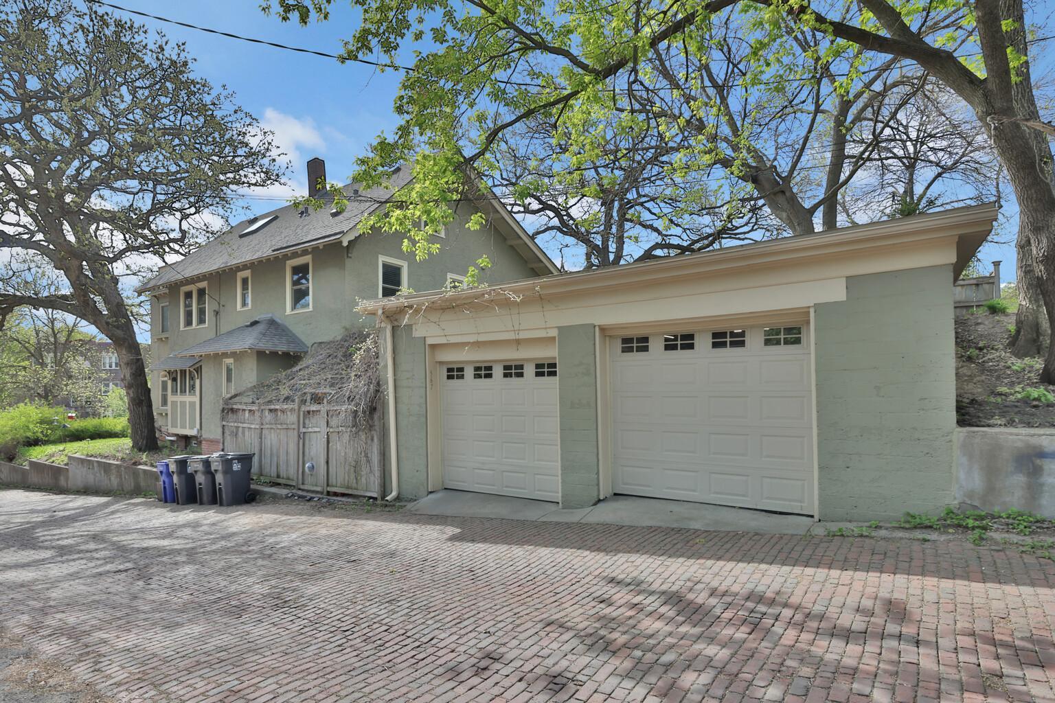 Convenient rear alley access to the original 1910 brick garage. A well-maintained, private entry point that offers easy two-car parking while preserving the home's impressive historic curb appeal.
