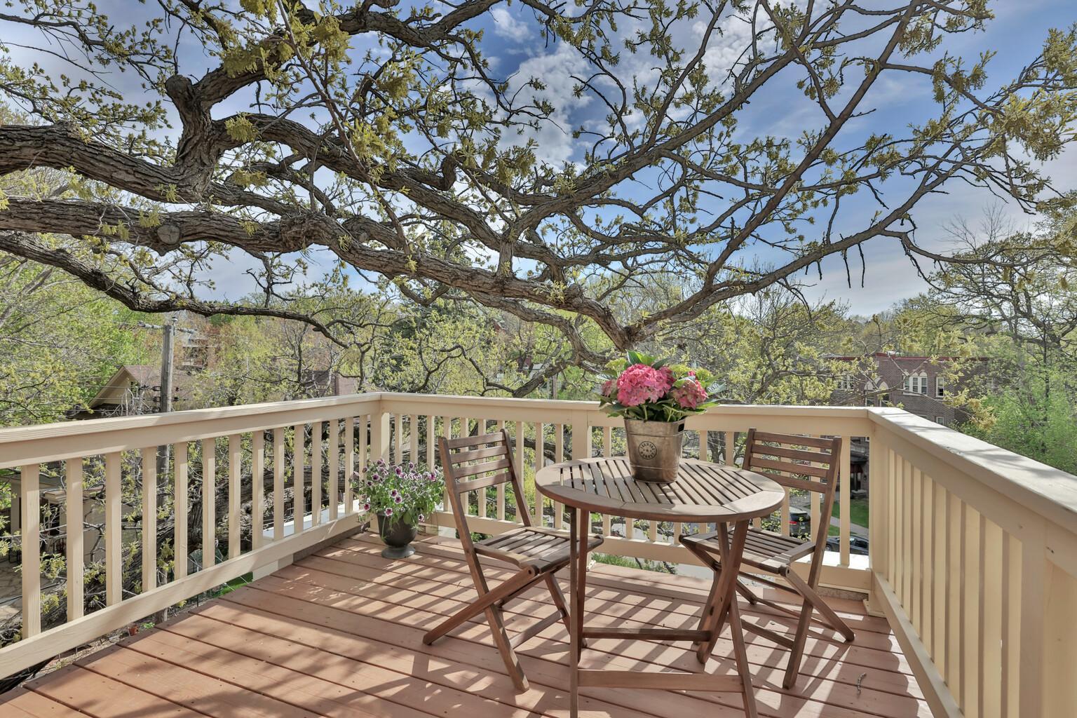 scape to your private rooftop oasis! This charming deck, nestled among the treetops, offers the perfect sun-drenched spot for morning coffee or intimate sunset dinner