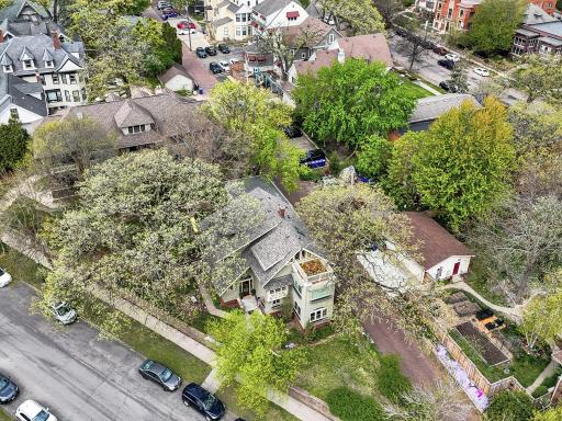 View from above highlighting the impressive new roof and stunning rooftop patio. This sun-drenched sanctuary offers incredible city views and a peaceful, private escape, all within a meticulously maintained historic estate.