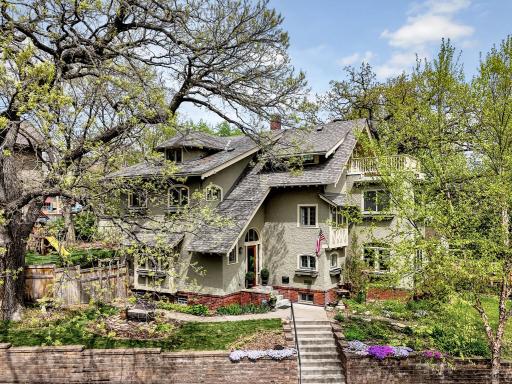 A spectacular first impression! An extra-long, gently sloped sidewalk leads you toward this historic masterpiece. Framed by mature oaks, the homeâs striking gabled architecture and timeless charm are on full display.